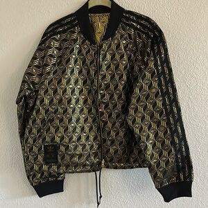 Adidas women’s reversible Black and Gold Geometric Jacket